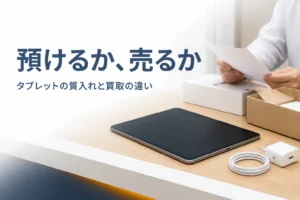 カウンターに置いたタブレットと書類を確かめる手元
